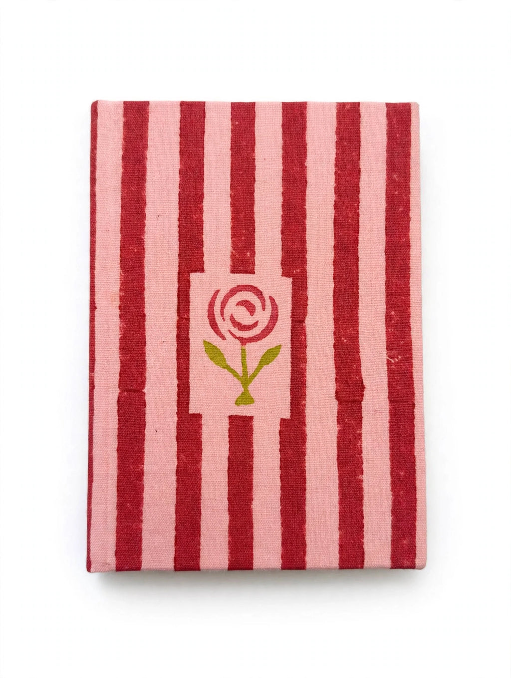 Rosebud diary open to a blank page beside a gold pen and dried flowers