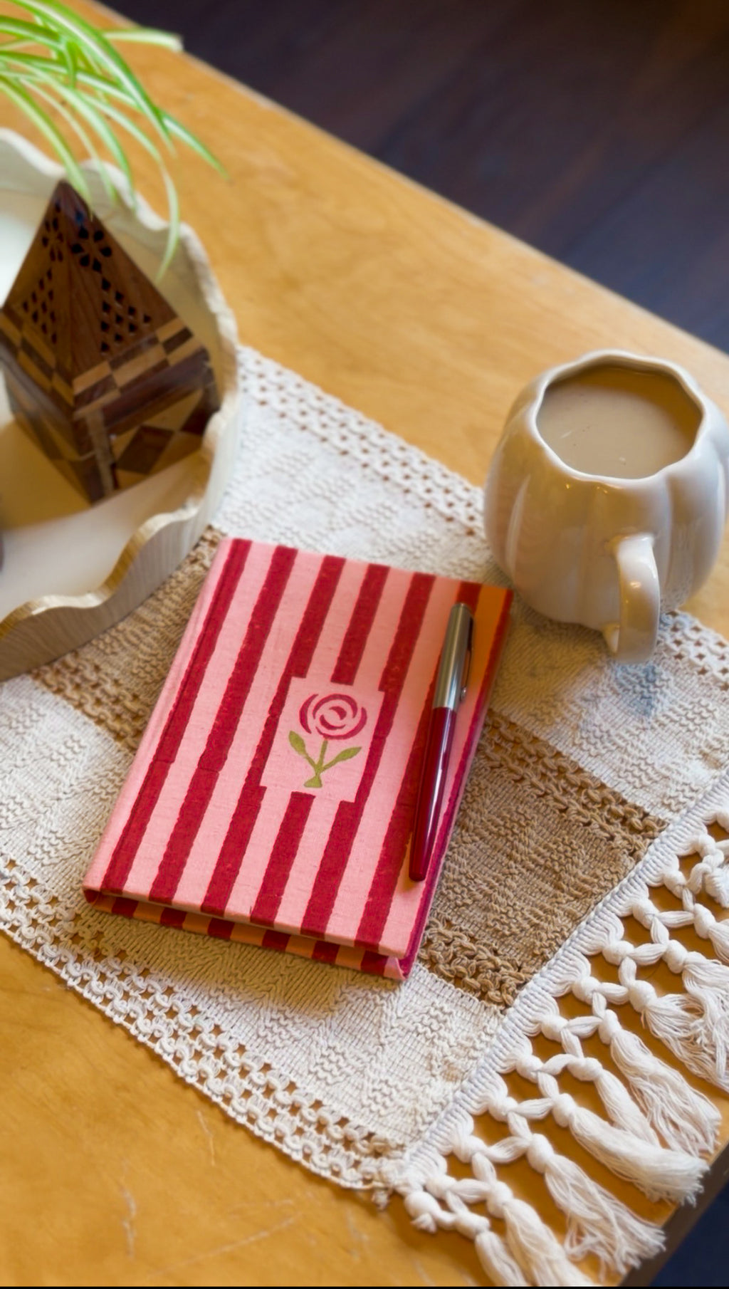 Rosebud diary held in hands